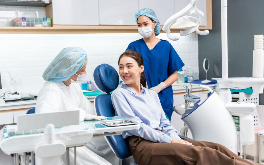 Patient Consulting With Dental Hygienist and Assistant