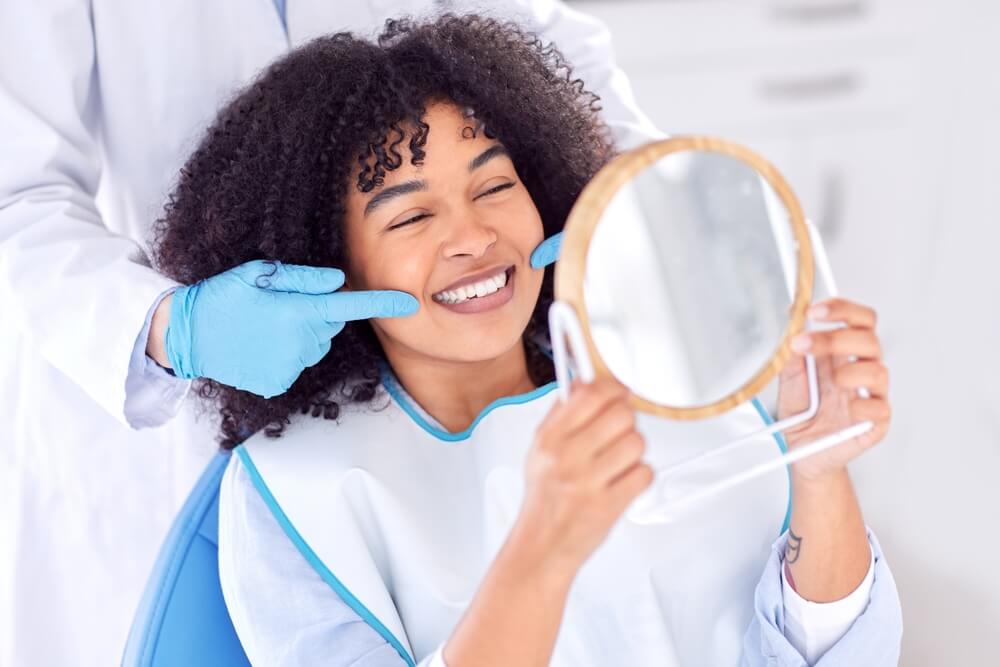 Female patient smiling at the dentist